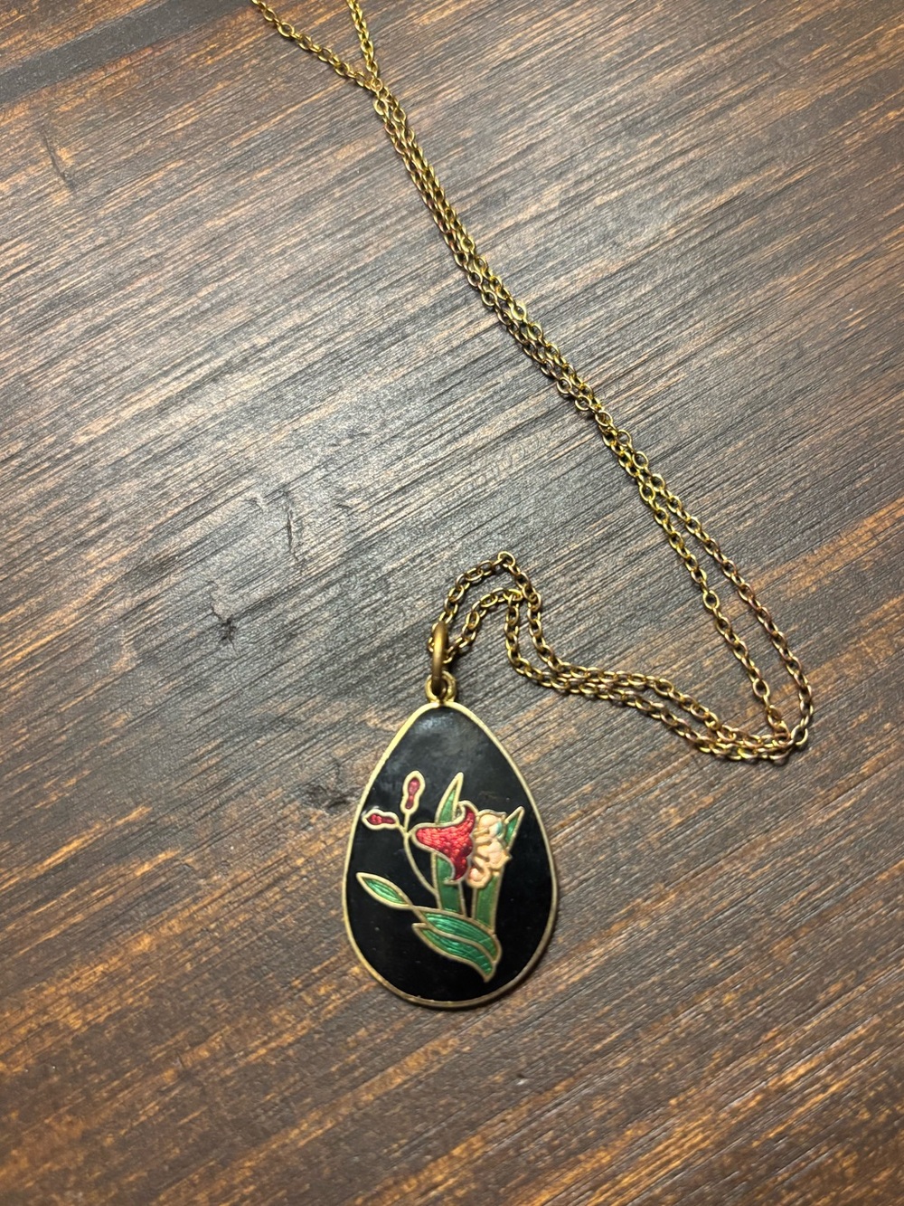 cloisonne flower pendant on a gold toned chain